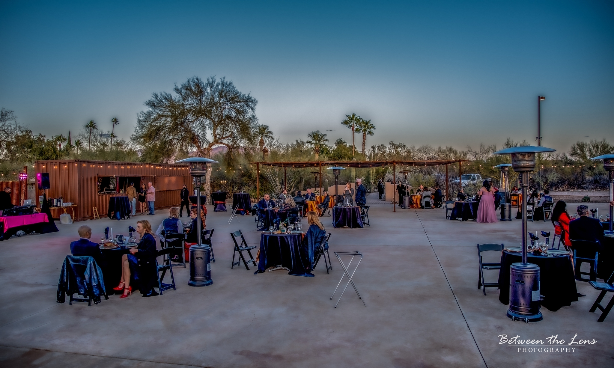 Outdoor seating with guests at the Sunset Venue